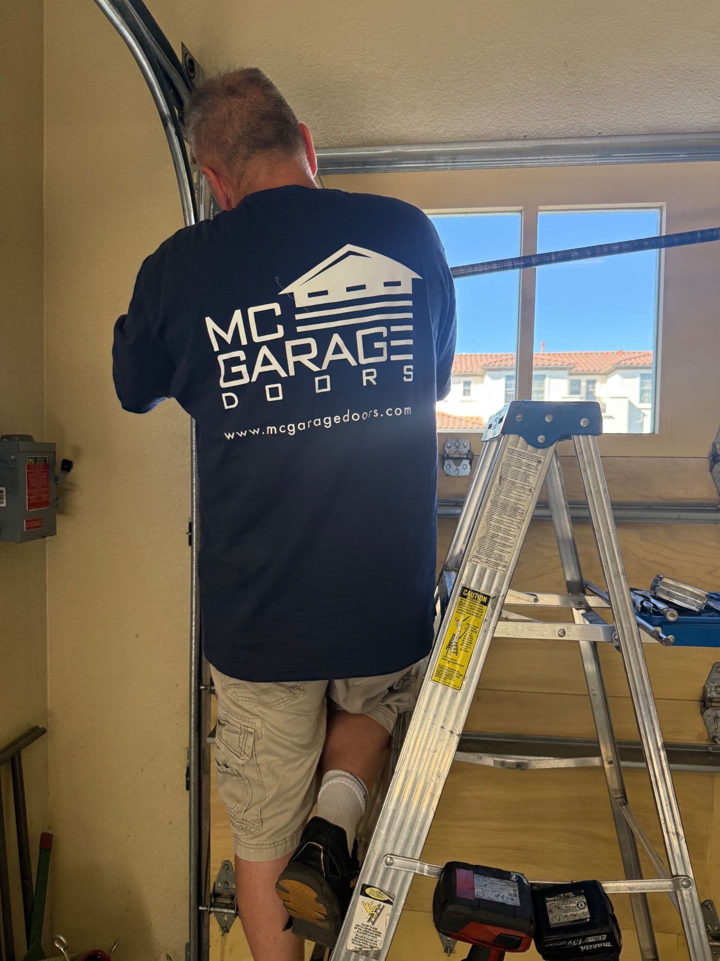 Project Family Teamwork on Garage Door Spring Change in Mountain View image