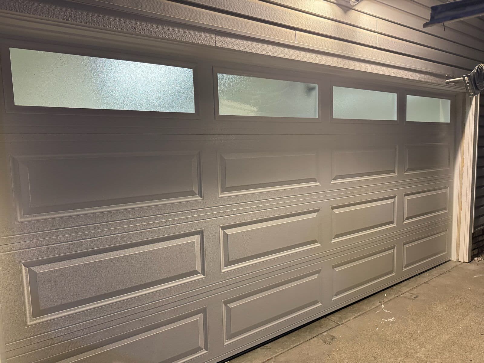 Project Sleek Garage Door Installation with Frosted Windows for Perfect Privacy image