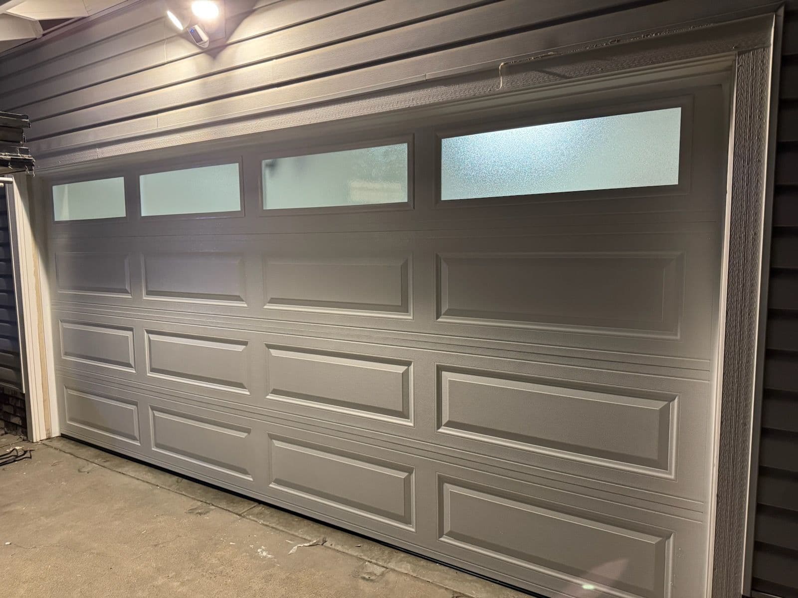 Gallery photos for Sleek Garage Door Installation with Frosted Windows for Perfect Privacy: Image #1